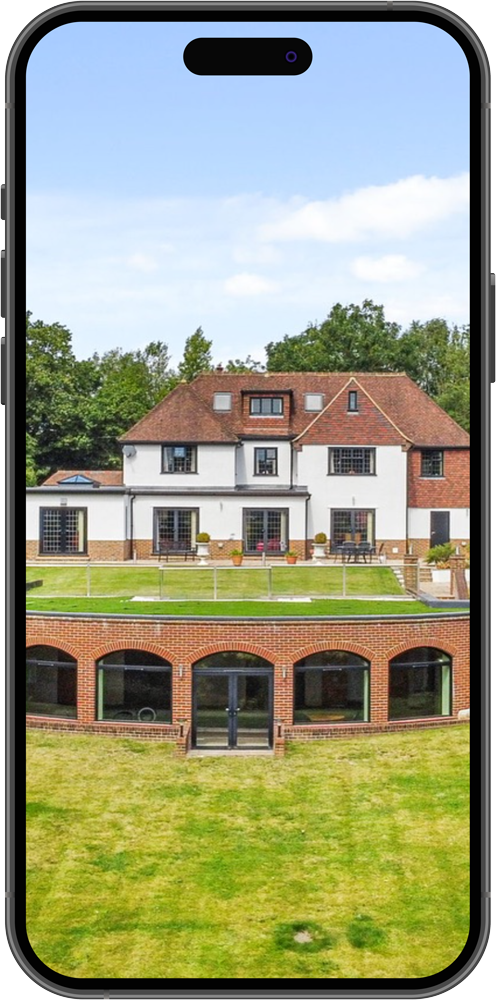Real estate marketing in Surrey & South West London phone showing luxury house